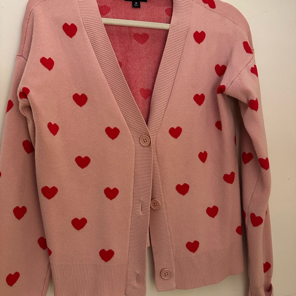 Cozy Pink Cardigan with Red Heart Pattern